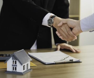 Home sales and home insurance concept. Business success, Real estate agents and customers shake hands to congratulate after signing.
