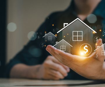Real estate concept business, home insurance and real estate protection. Real estate investment concept. Buy and sell houses and real estate online on a virtual screen.